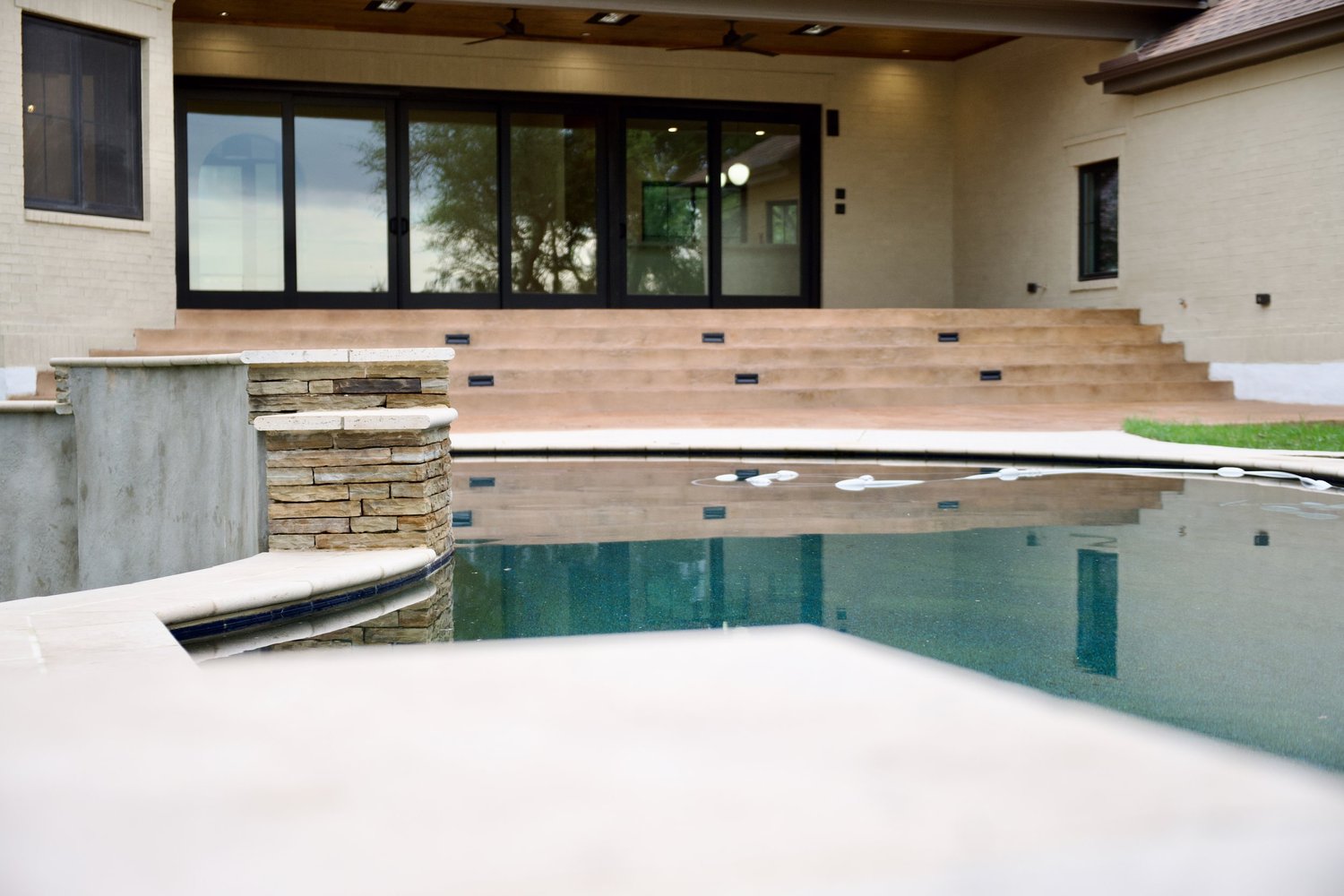 San Marcos project after the rebuild: lime-washed exterior